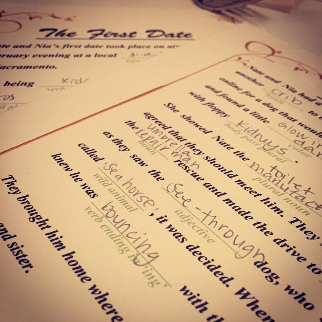 Handwritten words filling in the blanks of a Mad Libs game titled The First Date.